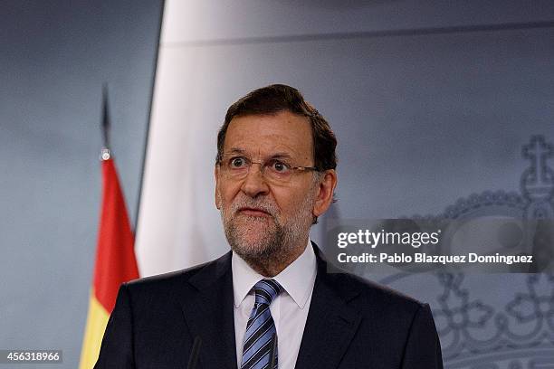 Spanish Prime Minister Mariano Rajoy speaks during a press conference after a gabinet meeting at Moncloa Palace on September 29, 2014 in Madrid,...