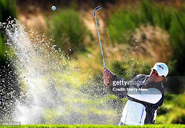 Phil Mickelson of the United States plays from a bunker on the 9th hole during the Morning Fourballs of the 2014 Ryder Cup on the PGA Centenary...