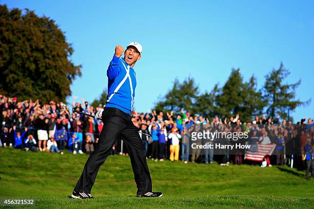 Sergio Garcia of Europe celebrates after he chipped in from a bunker on the 4th hole during the Morning Fourballs of the 2014 Ryder Cup on the PGA...