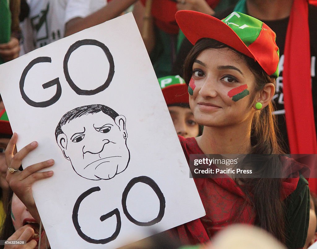 Thousand of  Imran Khan's supporters  wave their hands and...