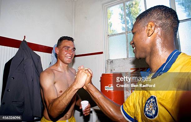 Leeds United players Vinnie Jones and Chris Fairclough celebrate after Leeds United had gained promotion to the 1st Division, after a division two...