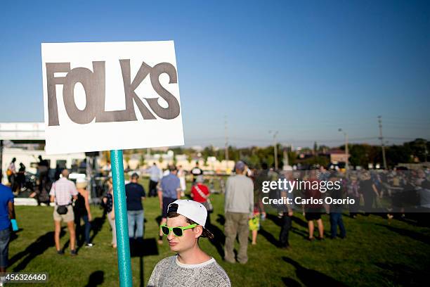 Michael Dunbar Junior brought a "folks" sign to Ford Fest in Etobicoke.
