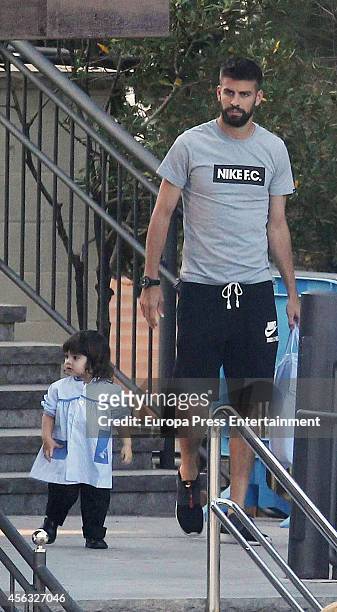 Gerard Pique takes his son Milan to school on September 29, 2014 in Barcelona, Spain.