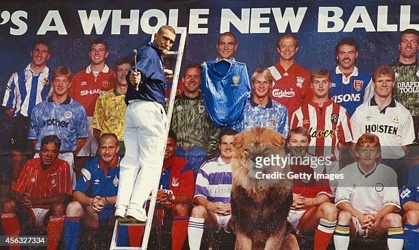 Wimbledon player Vinnie Jones nails a Wimbledon shirt to his image on a bill board promoting the first Premier League season in July 1992, Jones had...
