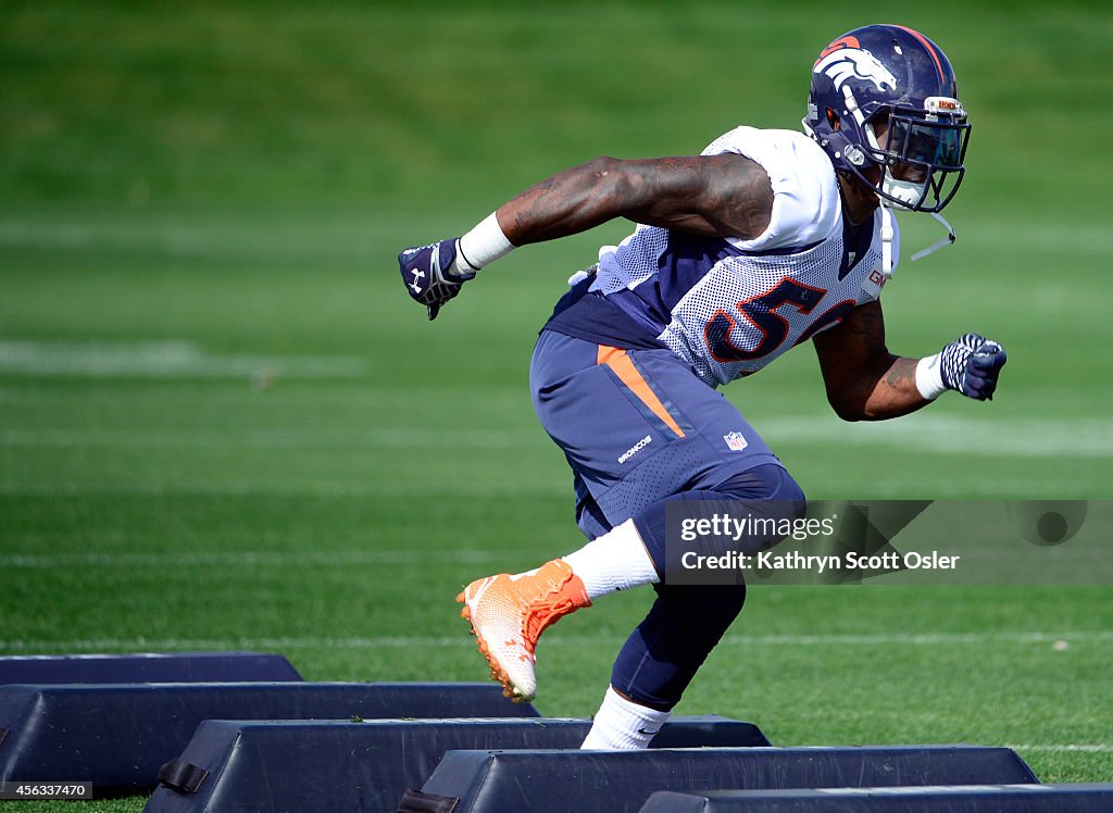 The Denver Broncos football team runs through their drills during practice at Dove Valley in Englewood, CO on Monday, Sept.  29, 2014.