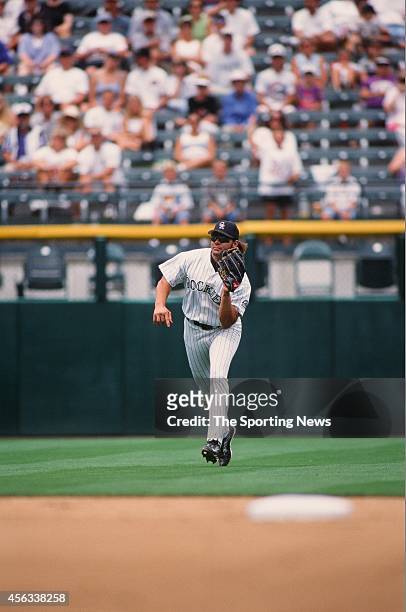 Dante Bichette of the Colorado Rockies fields against the Montreal Expos at Coors Field on August 15, 1999 in Denver, Colorado.