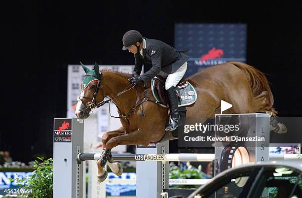 Rider Enrique Gonzalez of Mexico rides Quilebo du Tillard during the Longines Grand Prix class as part of the Longines Los Angeles Masters at Los...