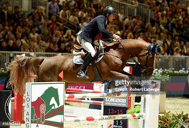 Rider Piergiorgio Bucci of Italy rides Catwalk Z during the Longines Grand Prix class as part of the Longines Los Angeles Masters at Los Angeles...