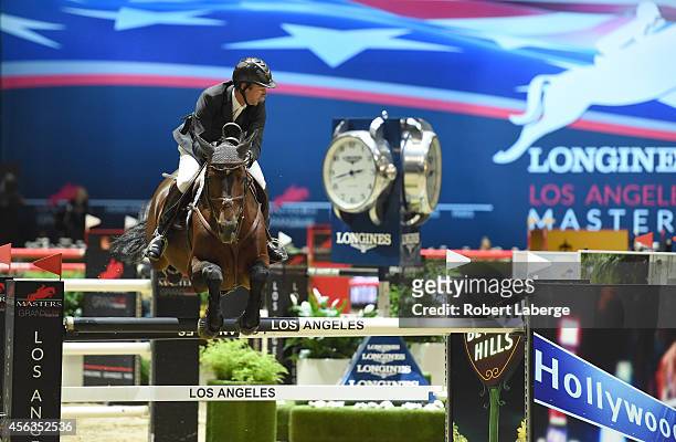 Rider Patrice Delaveau of France rides Carinjo during the Longines Grand Prix class as part of the Longines Los Angeles Masters at Los Angeles...