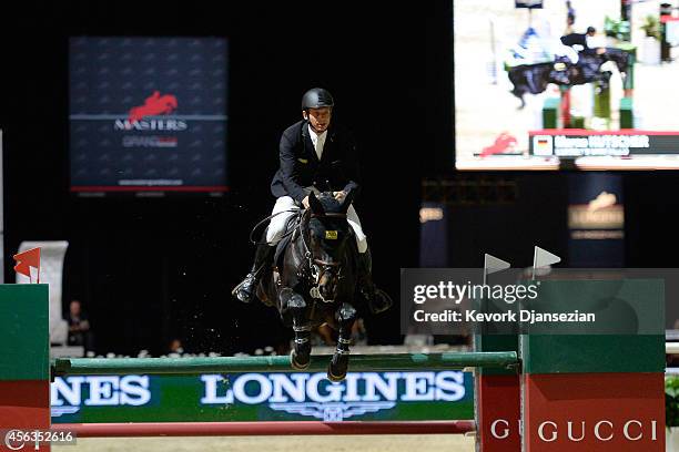 Rider Marco Kutscher rides Cornet's Cristallo during the Longines Grand Prix class as part of the Longines Los Angeles Masters at Los Angeles...