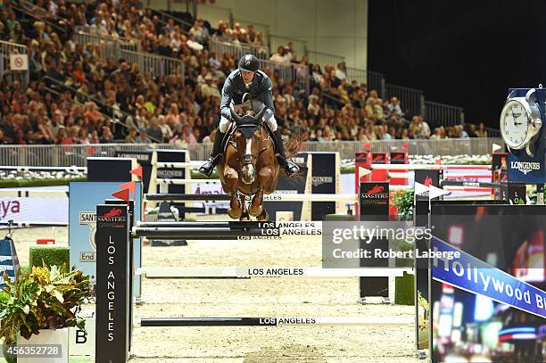 Rider Kevin Staut of France rides Estoy Aqui de Muze H D C during the Longines Grand Prix class as part of the Longines Los Angeles Masters at Los...