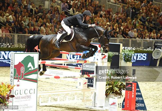 Rider Simon Delestre of France rides Ryan des Hayettes during the Longines Grand Prix class as part of the Longines Los Angeles Masters at Los...