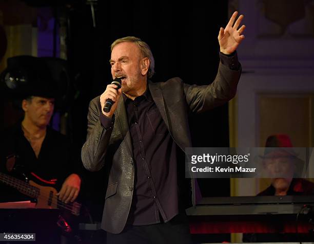 Neil Diamond performs onstage at Erasmus Hall High School on September 29, 2014 in Brooklyn, New York.