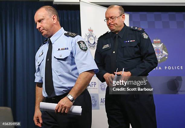Assistant Commissioner Neil Gaughan and Victoria Police Deputy Commissioner Graham Ashton leave after speaking to the media about the terrorism raids...