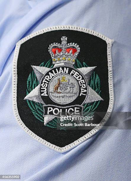 General view of the Australian Federal Police badge during a press conference about the terrorism raids that took place in Melbourne this morning at...