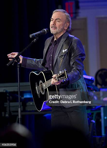 Musician Neil Diamond performs a special concert at Erasmus Hall High School, where he attended school over 50 years ago, on September 29, 2014 in...