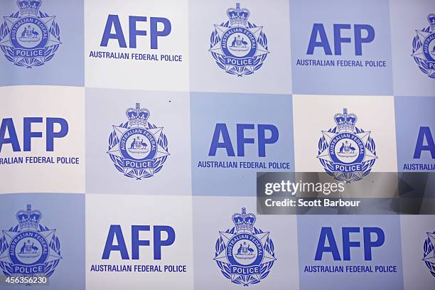 General view of the Australian Federal Police emblem during a press conference about the terrorism raids that took place in Melbourne this morning at...