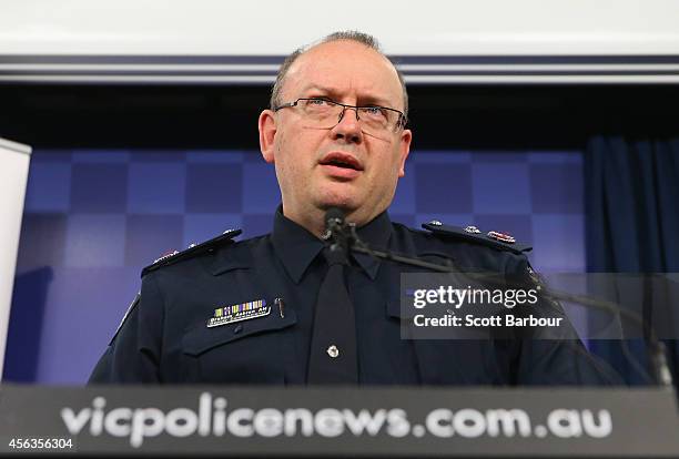 Victoria Police Deputy Commissioner Graham Ashton speaks to the media about the terrorism raids that took place in Melbourne this morning at Victoria...