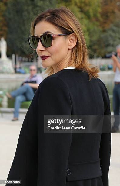 Clotilde Courau attends the Elie Saab fashion show at the Jardin des Tuileries as part of the Paris Fashion Week Womenswear Spring/Summer 2015 on...