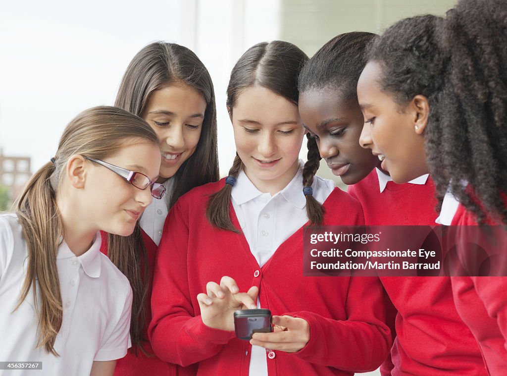 Students texting on mobile phone