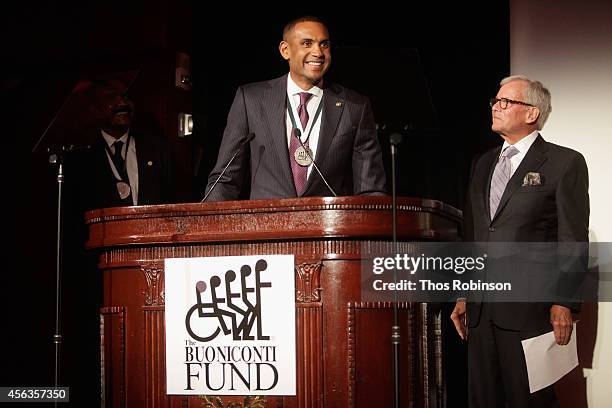 Former basketball player Grant Hill and journalist Tom Brokaw speak onstage at the 29th Annual Great Sports Legends Dinner to benefit The Buoniconti...