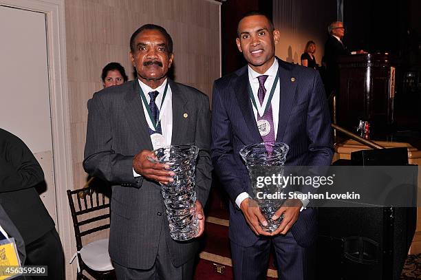 Former football player Calvin Hill and former basketball player Grant Hill pose at the 29th Annual Great Sports Legends Dinner to benefit The...