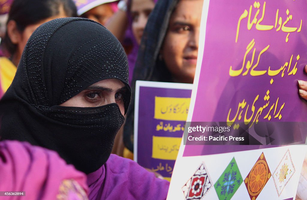 Large numbers of members of Pakistani Working Women raise...