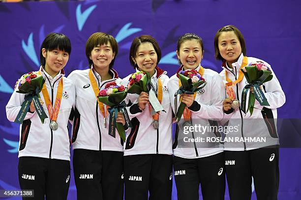 Silver medallists Japan's women's team Kasumi Ishikawa, Ai Fukuhara, Sayaka Hirano, Misako Wakamiya and Miu Hirano stand on the podium for the award...