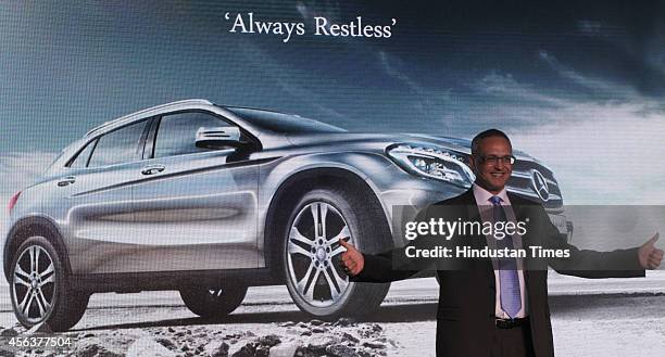 Eberhard Kern, Managing Director and CEO, Mercedes-Benz India gestures during the launch of the Mercedes-Benz GLA-Class luxury SUV car on September...