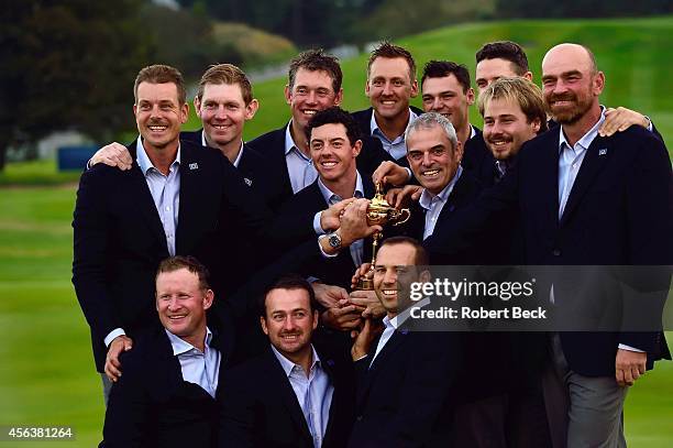 Group photo of Team Europe victorious, posing with trophy for team portrait after winning Sunday Singles Matches and tournament on PGA Centenary...