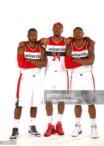 John Wall, Paul Pierce and Bradley Beal of the Washington Wizards pose for a portrait during Media Day at the Verizon Center on September 29, 2014 in...