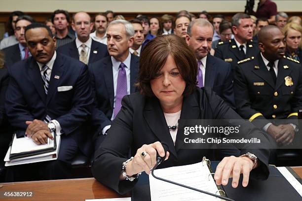 Secret Service Director Julia Pierson prepares to testify to the House Oversight and Government Reform Committee on the White House perimeter breach...