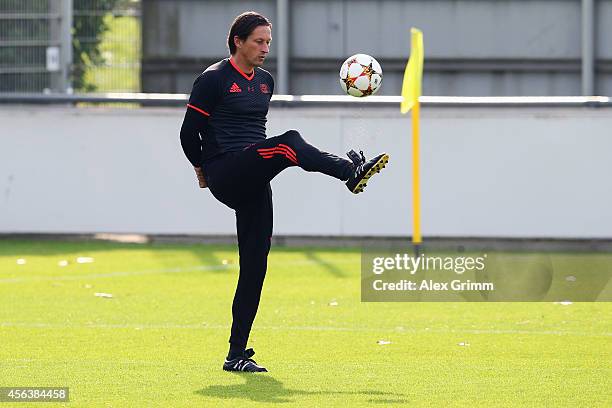 Head coach Roger Schmidt attends a Bayer Leverkusen training session ahead of their UEFA Champions League Group C match against SL Benfica at...