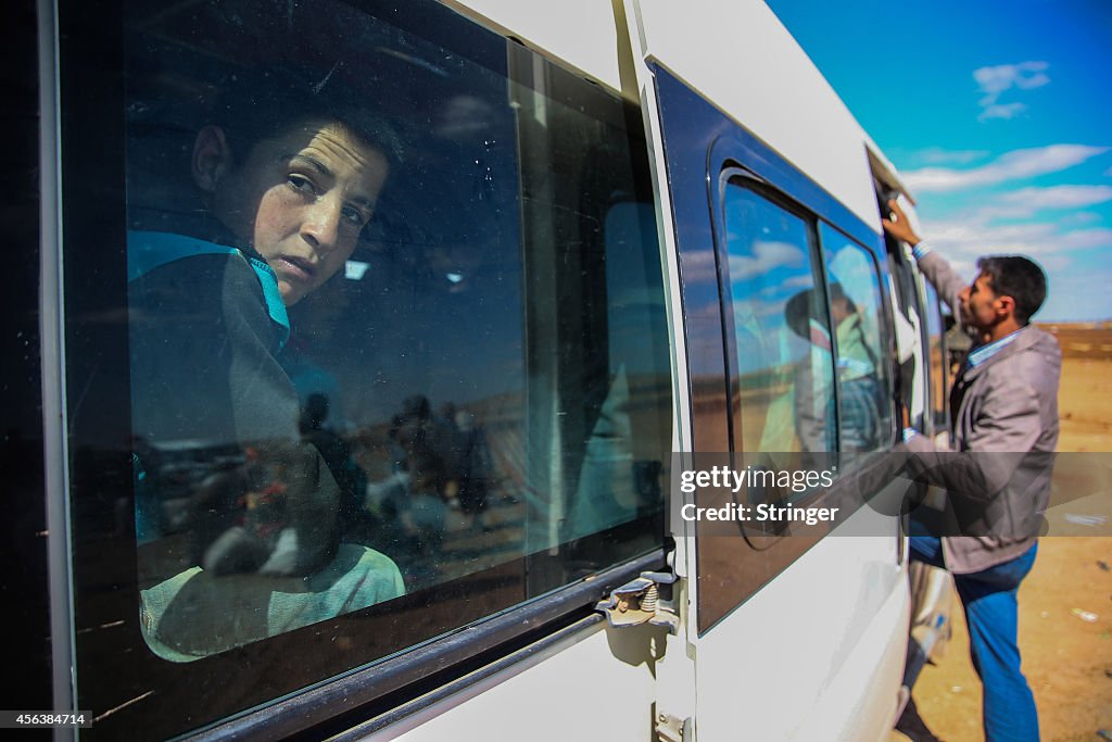 Syrian Kurds Fleeing The Islamic State Militants Cross Into Turkey