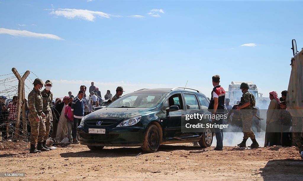 Syrian Kurds Fleeing The Islamic State Militants Cross Into Turkey