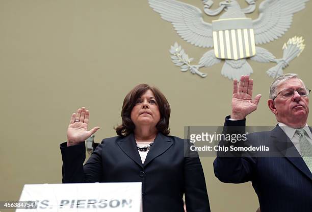 Secret Service Director Julia Pierson and Commissioner for U.S. Customs and Border Protection W. Ralph Basham are sworn in before testifying to the...