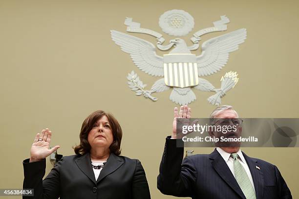 Secret Service Director Julia Pierson and Commissioner for U.S. Customs and Border Protection W. Ralph Basham are sworn in before testifying to the...