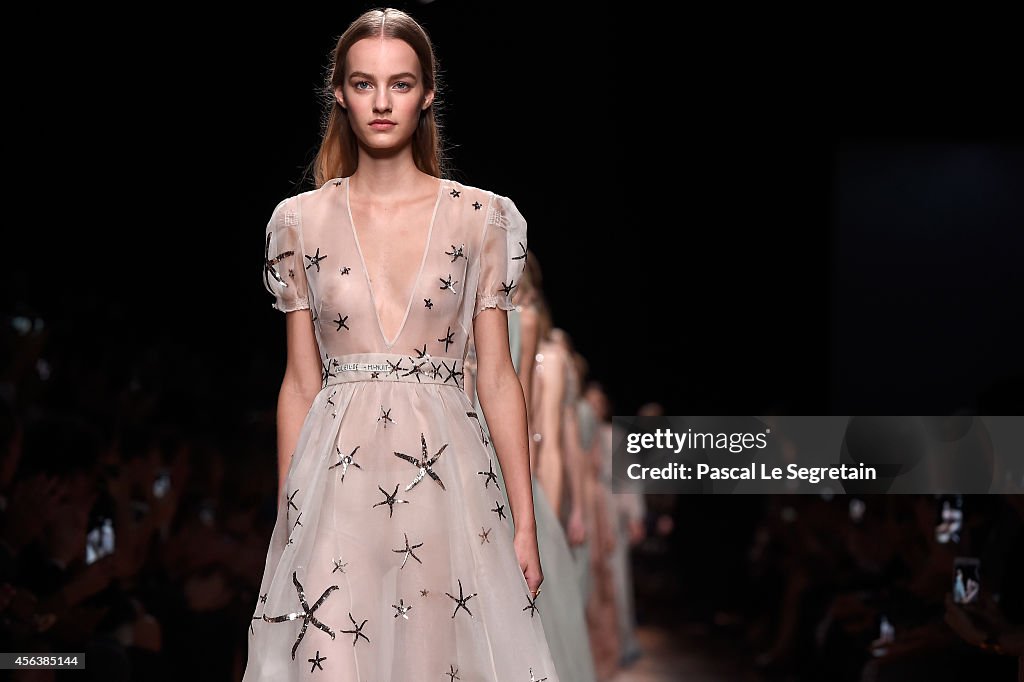 Models walk the runway during the Valentino show as part of the Paris ...