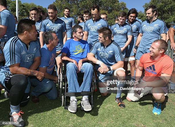 The All Blacks captain Richie McCaw talks to former Springbok Joost van der Westhuizen, who now suffers with motor neurone disease, after the All...