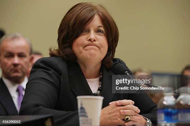 Secret Service Director Julia Pierson prepares to testify to the House Oversight and Government Reform Committee on the White House perimeter breach...