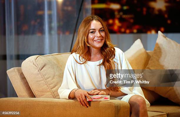 Lindsay Lohan attends a photocall for "Speed The Plow" at Playhouse Theatre on September 30, 2014 in London, England.