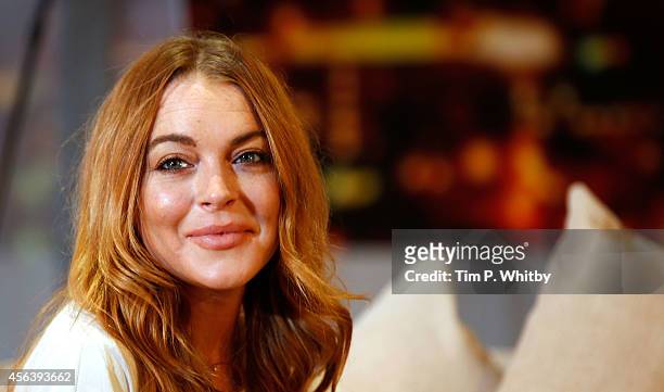 Lindsay Lohan performs during a photocall for "Speed The Plow" at Playhouse Theatre on September 30, 2014 in London, England.