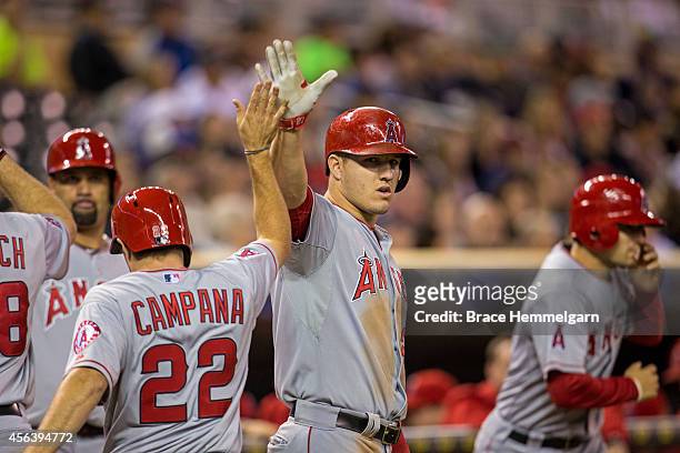 Mike Trout of the Los Angeles Angels of Anaheim celebrates with Tony Campana against the Minnesota Twins on September 5, 2014 at Target Field in...