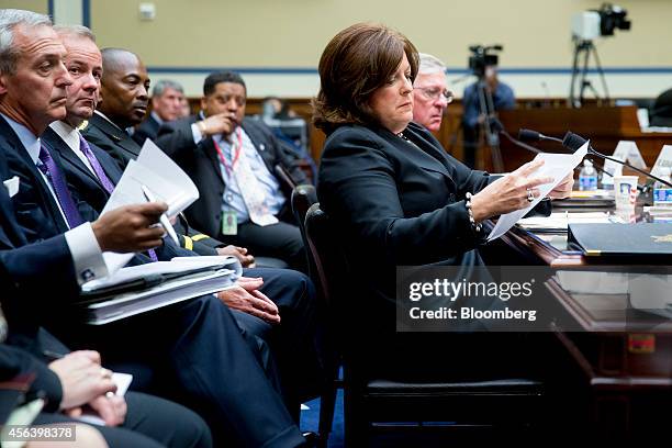 Julia Pierson, director of the U.S. Secret Service, looks at a document during a House Oversight Committee hearing in Washington, D.C., U.S., on...