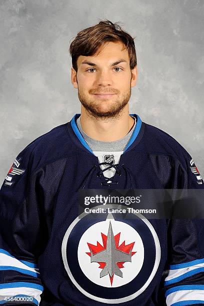 Michael Frolik of the Winnipeg Jets poses for his official headshot for the 2014-2015 season on September 18, 2014 at the MTS Centre in Winnipeg,...