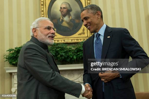 Indian Prime Minister Narendra Modi and US President Barack Obama shake hands after a meeting in the Oval Office of the White House September 30,...