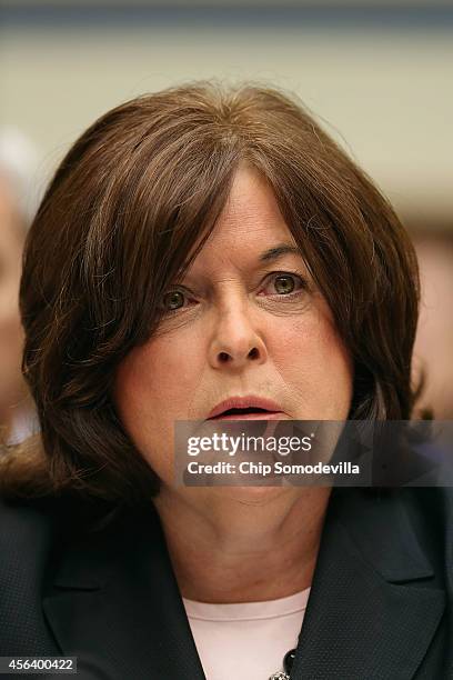 Secret Service Director Julia Pierson prepares to testify to the House Oversight and Government Reform Committee on the White House perimeter breach...