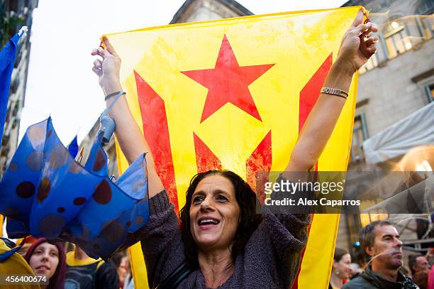 Catalan Pro-independence demonstrators protest in front of the Barcelona City Hall against the suspension of the self-determination referendum by the...