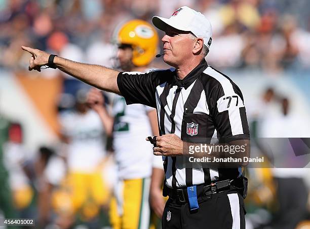 Referee Terry McAulay makes a call during a game between the Chicago Bears and the Green Bay Packers at Soldier Field on September 28, 2014 in...