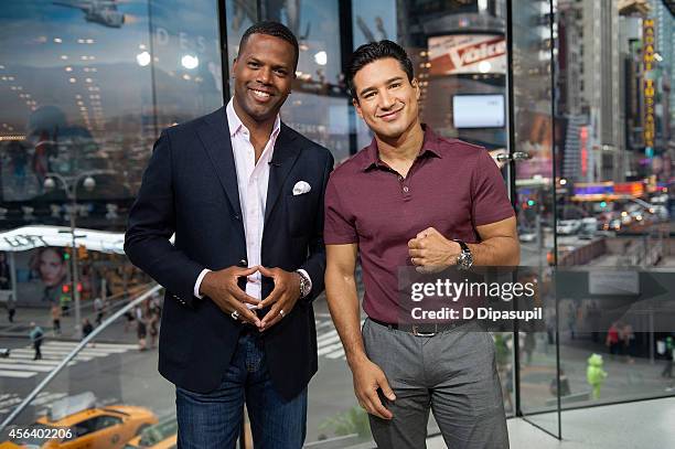 Mario Lopez and AJ Calloway host "Extra" at their New York studios at H&M in Times Square on September 30, 2014 in New York City.